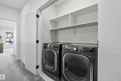 Laundry closet with stacked shelving and tile flooring - 