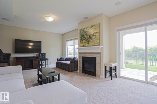 #16 8132 217 St Nw, Edmonton, AB - Indoor Photo Showing Living Room With Fireplace