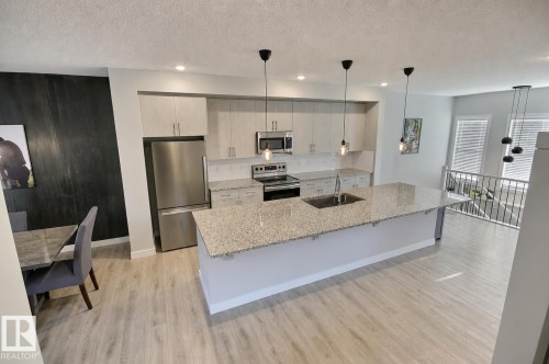 17455 77 Street Nw, Edmonton, AB - Indoor Photo Showing Kitchen With Upgraded Kitchen