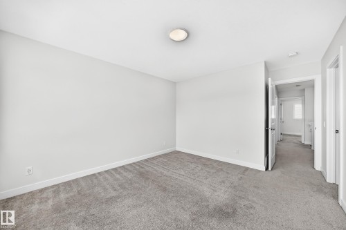Recessed lighting, light-toned walls, and grey carpet flooring - 3816 Chrustawka Place Sw, Edmonton, AB - Indoor Photo Showing Other Room