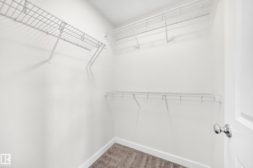 White wire shelving system - 3816 Chrustawka Place Sw, Edmonton, AB - Indoor With Storage