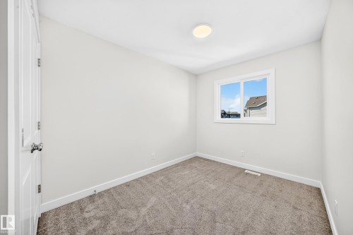 Neutral wall paint and trim - 3816 Chrustawka Place Sw, Edmonton, AB - Indoor Photo Showing Other Room