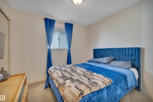 Carpeted flooring, window with blinds, and ceiling-mounted lighting - 4224 53 Ave, Wetaskiwin, AB - Indoor Photo Showing Bedroom