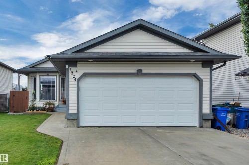 Single-story residence featuring light-colored siding with dark trim accents - 4224 53 Ave, Wetaskiwin, AB - Outdoor
