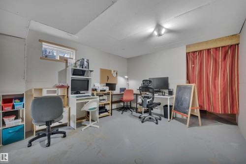 Room with light gray walls and a small window, featuring a light gray floor, and overhead lighting - 4224 53 Ave, Wetaskiwin, AB - Indoor Photo Showing Office