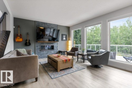2335 Sparrow Crescent Nw, Edmonton, AB - Indoor Photo Showing Living Room With Fireplace