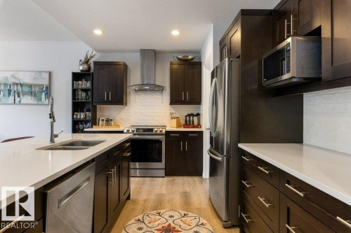 2335 Sparrow Crescent Nw, Edmonton, AB - Indoor Photo Showing Kitchen With Double Sink With Upgraded Kitchen