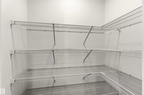 White wire shelving system providing multiple levels of storage - 265 Chappelle Drive Sw, Edmonton, AB - Indoor With Storage