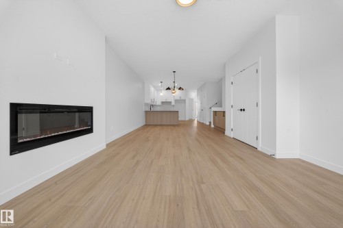 3734 Erlanger Drive Nw, Edmonton, AB - Indoor Photo Showing Other Room With Fireplace