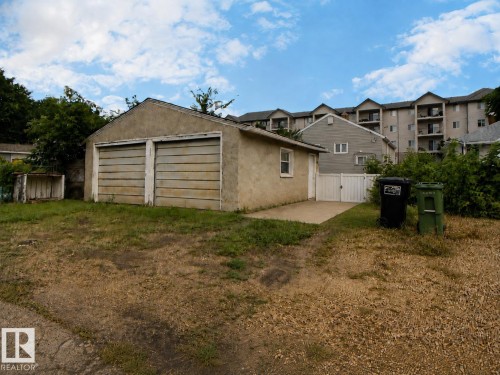 Two-car detached garage with stucco exterior and panel garage doors - 11336 83 Street Nw, Edmonton, AB - Outdoor