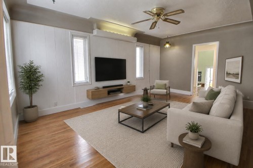 Hardwood flooring throughout, recessed ceiling with accent lighting, and a ceiling fan with integrated lighting - 11336 83 Street Nw, Edmonton, AB - Indoor Photo Showing Living Room