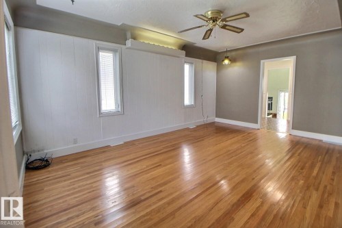 Hardwood flooring throughout, with a ceiling fan, and recessed lighting - 11336 83 Street Nw, Edmonton, AB - Indoor Photo Showing Other Room