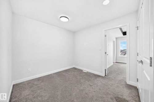 Neutral wall finishes, recessed ceiling lighting, and gray carpet flooring - 8823 Carson Way Sw, Edmonton, AB - Indoor Photo Showing Other Room