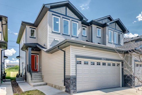 Contemporary two-story exterior with horizontal siding and decorative gables - 8823 Carson Way Sw, Edmonton, AB - Outdoor