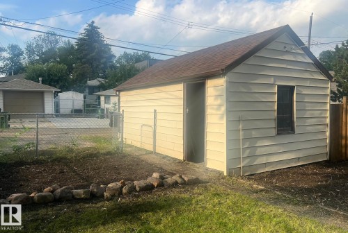 Detached outbuilding with horizontal siding and an asphalt shingle roof - 9828 84 Avenue Nw, Edmonton, AB - Outdoor