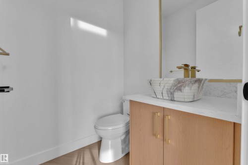 White walls with wood-finish flooring - 465 Crystal Creek Link, Leduc, AB - Indoor Photo Showing Bathroom