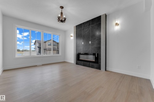 458 Crystal Creek Link, Leduc, AB - Indoor Photo Showing Living Room With Fireplace