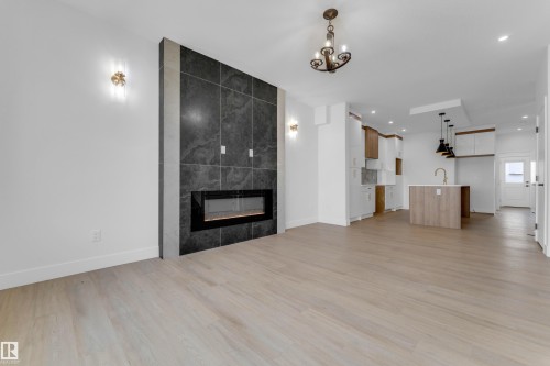 458 Crystal Creek Link, Leduc, AB - Indoor Photo Showing Living Room With Fireplace