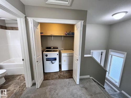 27 Deer Coulee Drive, Didsbury, AB - Indoor Photo Showing Laundry Room