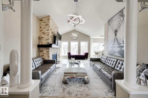 876 Hodgins Road Nw, Edmonton, AB - Indoor Photo Showing Living Room With Fireplace