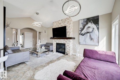876 Hodgins Road Nw, Edmonton, AB - Indoor Photo Showing Living Room With Fireplace