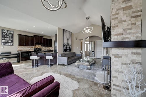 876 Hodgins Road Nw, Edmonton, AB - Indoor Photo Showing Living Room With Fireplace
