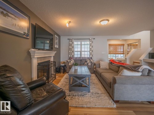 12124 17 Avenue Sw, Edmonton, AB - Indoor Photo Showing Living Room With Fireplace