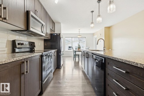8060 Evans Crescent Nw, Edmonton, AB - Indoor Photo Showing Kitchen With Upgraded Kitchen
