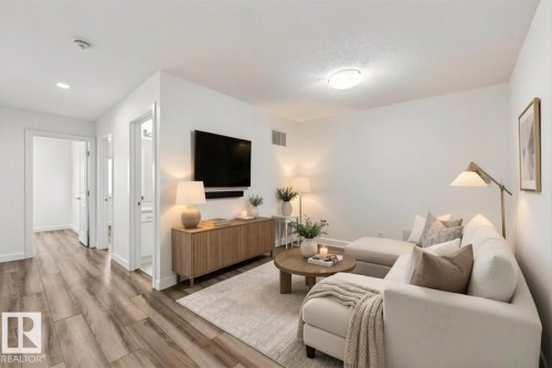 Photo has been virtually staged - 4853 Alwood Point(E) Sw, Edmonton, AB - Indoor Photo Showing Living Room