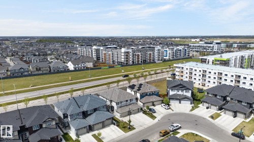 Residential neighborhood featuring multi-story homes, cul-de-sac street design, and adjacent multi-unit residential buildings - 4853 Alwood Point(E) Sw, Edmonton, AB - Outdoor With View