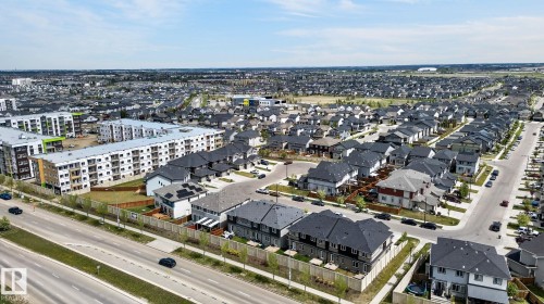 Residential neighborhood featuring a mix of detached homes and multi-story apartment buildings - 4853 Alwood Point(E) Sw, Edmonton, AB - Outdoor With View