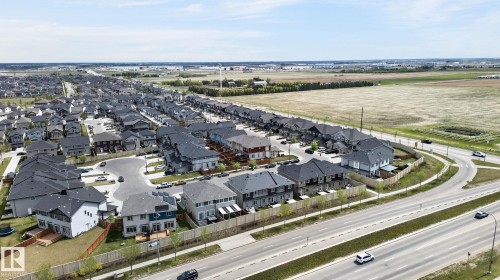 Sprawling residential development with uniform rooflines, cul-de-sac street layouts, and clear access to a multi-lane roadway - 4853 Alwood Point(E) Sw, Edmonton, AB - Outdoor With View