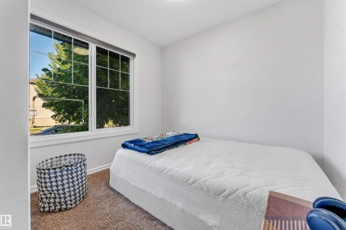 Room with neutral wall paint and carpet flooring - 2040 24 Street Nw, Edmonton, AB - Indoor Photo Showing Bedroom
