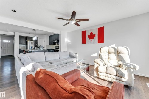Open concept living space with wood-finish flooring - 2040 24 Street Nw, Edmonton, AB - Indoor Photo Showing Living Room