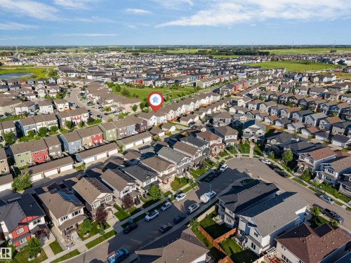 Residential neighborhood featuring detached homes and townhouses, with visible green spaces - 2040 24 Street Nw, Edmonton, AB - Outdoor With View