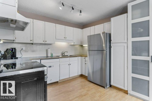 3237 132A Avenue Nw, Edmonton, AB - Indoor Photo Showing Kitchen With Double Sink