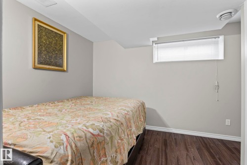 Wood-finish flooring - 3403 23 Nw, Edmonton, AB - Indoor Photo Showing Bedroom