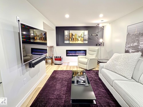 #17 10 Blackburn Dr Sw, Edmonton, AB - Indoor Photo Showing Living Room With Fireplace