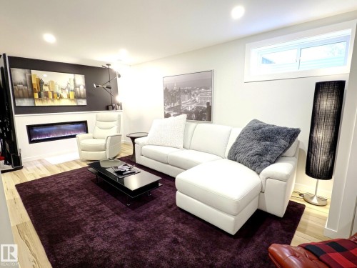 #17 10 Blackburn Dr Sw, Edmonton, AB - Indoor Photo Showing Living Room With Fireplace