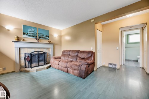 13204 47 Street Nw, Edmonton, AB - Indoor Photo Showing Living Room With Fireplace