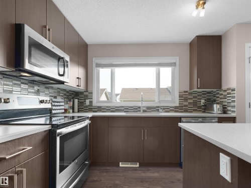 1318 Chappelle Boulevard Sw, Edmonton, AB - Indoor Photo Showing Kitchen With Double Sink With Upgraded Kitchen
