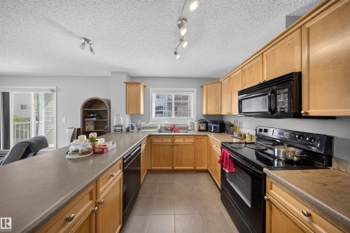 #215 4403 23 St Nw, Edmonton, AB - Indoor Photo Showing Kitchen With Double Sink