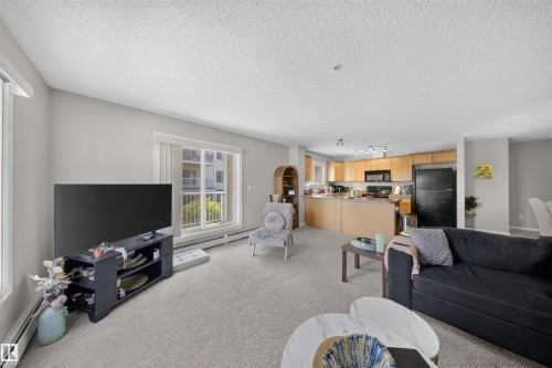#215 4403 23 St Nw, Edmonton, AB - Indoor Photo Showing Living Room