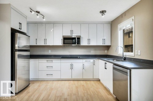 #33 2503 24 St Nw, Edmonton, AB - Indoor Photo Showing Kitchen With Double Sink