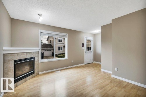 #33 2503 24 St Nw, Edmonton, AB - Indoor Photo Showing Other Room With Fireplace