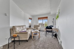 Carpeted flooring, white painted walls, wood-finish window blinds, and a built-in wall heater - 