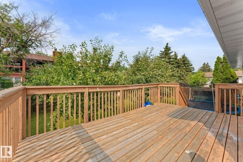 Spacious wood deck with a full wood railing, offering an elevated outdoor area - 34 Stirling Road Nw, Edmonton, AB - Outdoor With Deck Patio Veranda With Exterior