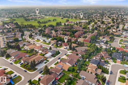 Aerial perspective showcasing a residential neighborhood with varied housing styles - 34 Stirling Road Nw, Edmonton, AB - Outdoor With View