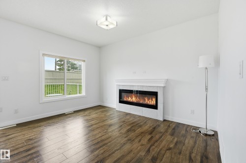 7258 Chivers Place Sw, Edmonton, AB - Indoor Photo Showing Living Room With Fireplace