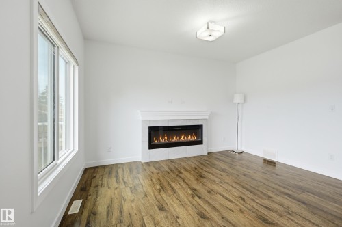 7258 Chivers Place Sw, Edmonton, AB - Indoor Photo Showing Living Room With Fireplace